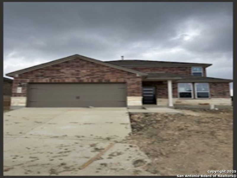 Front exterior of a new home in Comanche Ridge, San Antonio, TX, highlighting curb appeal (Image 13). Front exterior of a new home in Comanche Ridge, San Antonio, TX, highlighting curb appeal (Image 13).