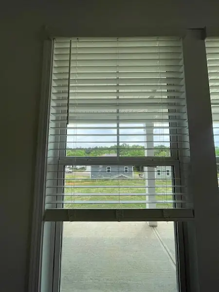 This interior view showcases the window with verti
