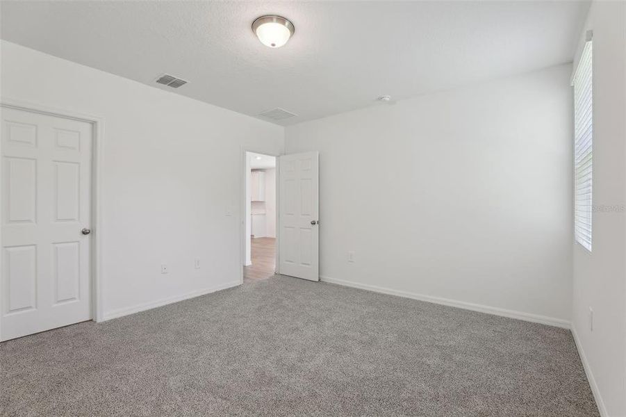 Spacious, unfurnished interior of a new home in Lawson Dunes - Signature Series, Haines City (Image 20).