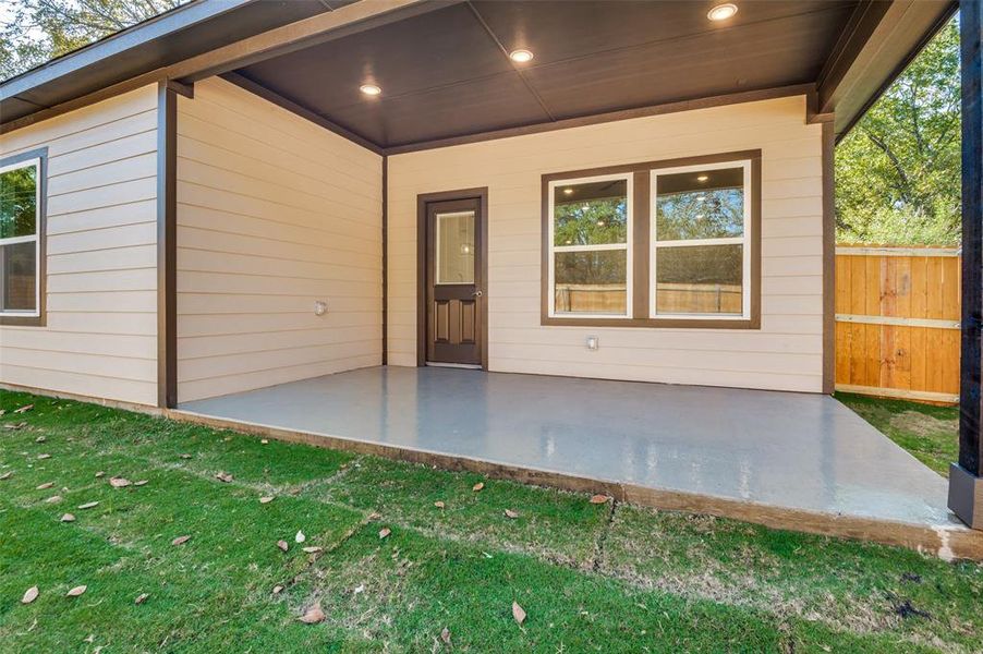 View of exterior entry featuring a patio