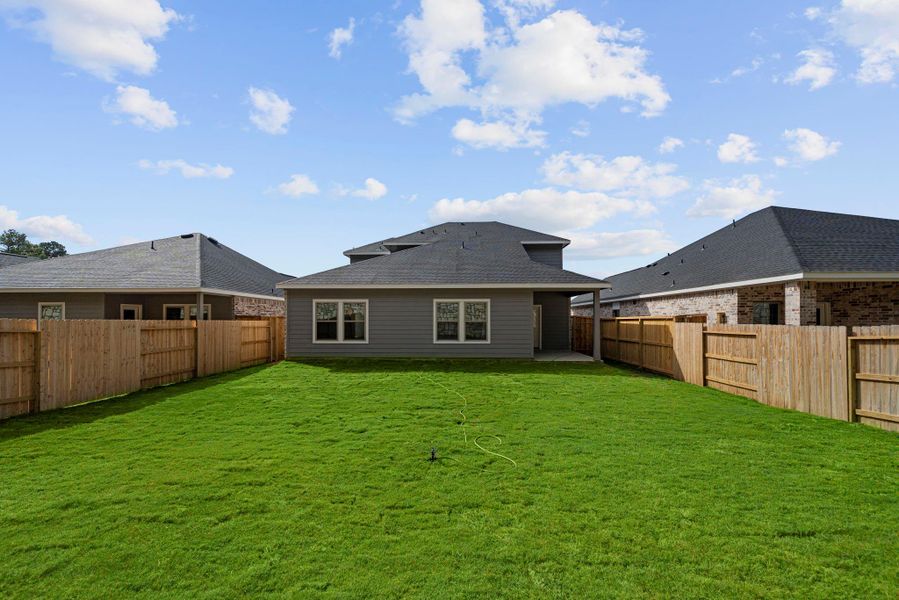 Exterior details and patio area of a home in Westridge Cove, Conroe (Image 3).