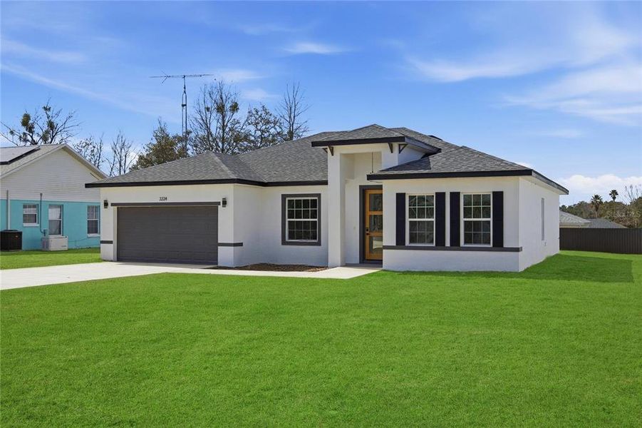 Front exterior of a new home in , Ocala, FL, highlighting curb appeal (Image 1). Front exterior of a new home in , Ocala, FL, highlighting curb appeal (Image 1).