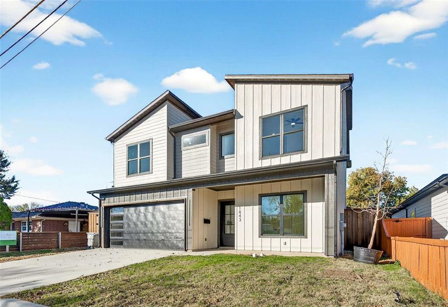 Contemporary house featuring board and batten siding, concrete driveway, and a garage Contemporary house featuring board and batten siding, concrete driveway, and a garage
