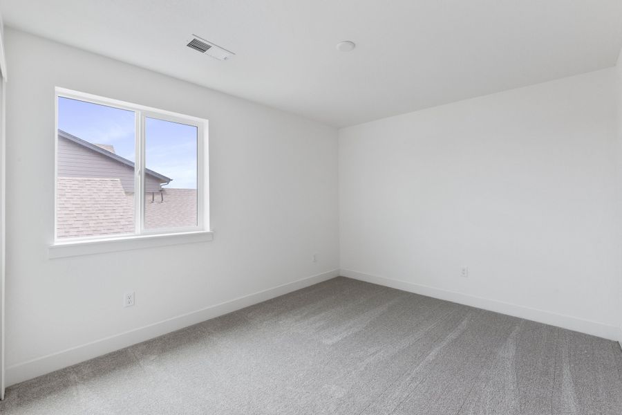 Spacious, unfurnished interior of a new home in Trailside on Harmony, Timnath (Image 49).