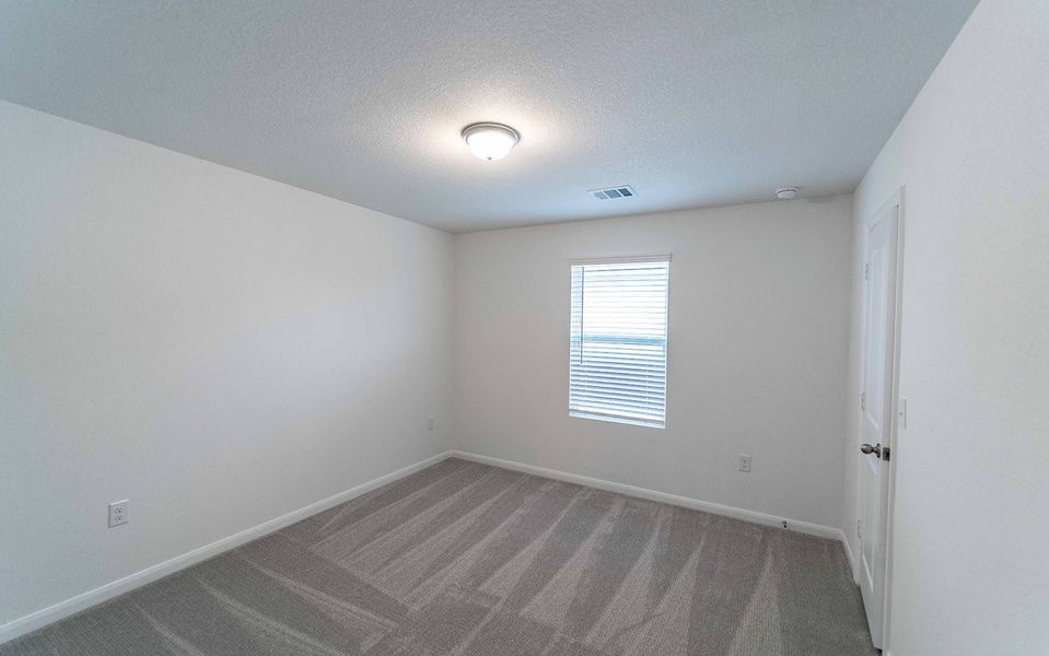 Spacious, unfurnished interior of a new home in Brooklands, Hutto (Image 16).