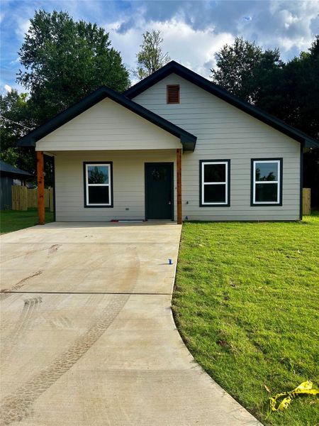 Front exterior of a new home in , Longview, TX, highlighting curb appeal (Image 1). Front exterior of a new home in , Longview, TX, highlighting curb appeal (Image 1).
