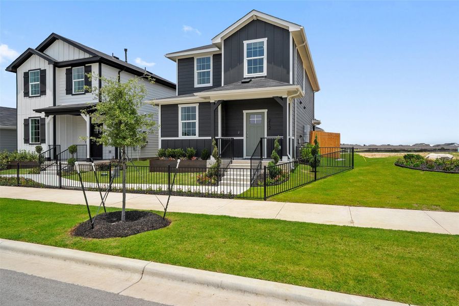 Front exterior of a new home in Valverde, Bastrop, TX, highlighting curb appeal (Image 20). Front exterior of a new home in Valverde, Bastrop, TX, highlighting curb appeal (Image 20).