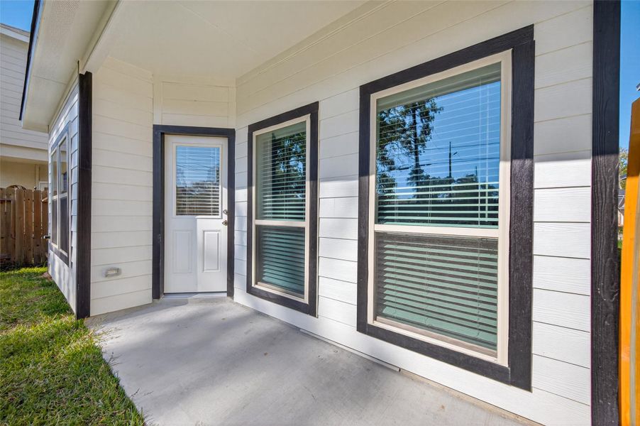 Exterior details and patio area of a home in Woodland Lakes, Huffman (Image 32). Exterior details and patio area of a home in Woodland Lakes, Huffman (Image 32).