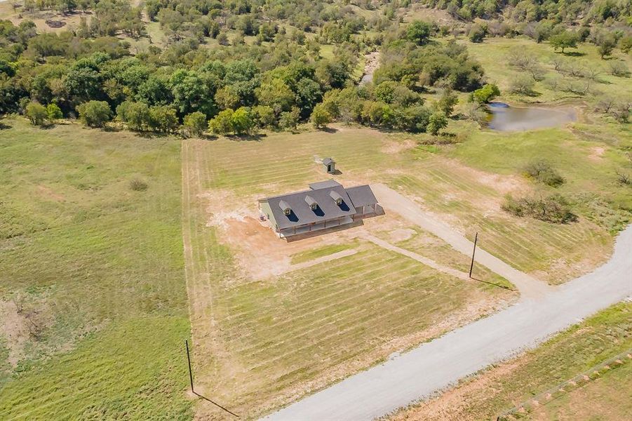 Aerial view of property's location featuring rural landscape and a nearby body of water Aerial view of property's location featuring rural landscape and a nearby body of water