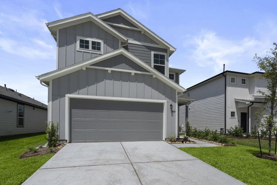 Front exterior of a new home in Peppervine, Porter, TX, highlighting curb appeal (Image 14). Front exterior of a new home in Peppervine, Porter, TX, highlighting curb appeal (Image 14).
