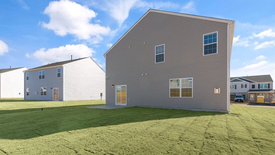 Exterior details and patio area of a home in Ridgewood Farms, Winterville (Image 23).