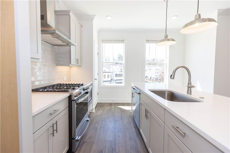 Natural light floods the kitchen*Photo of model home in a different community. Used for illustrative purposes only*