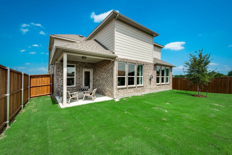 Spacious, fenced-in backyard with covered patio