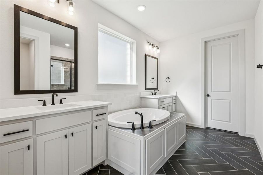Ample room for two in this thoughtfully designed owner's bath.