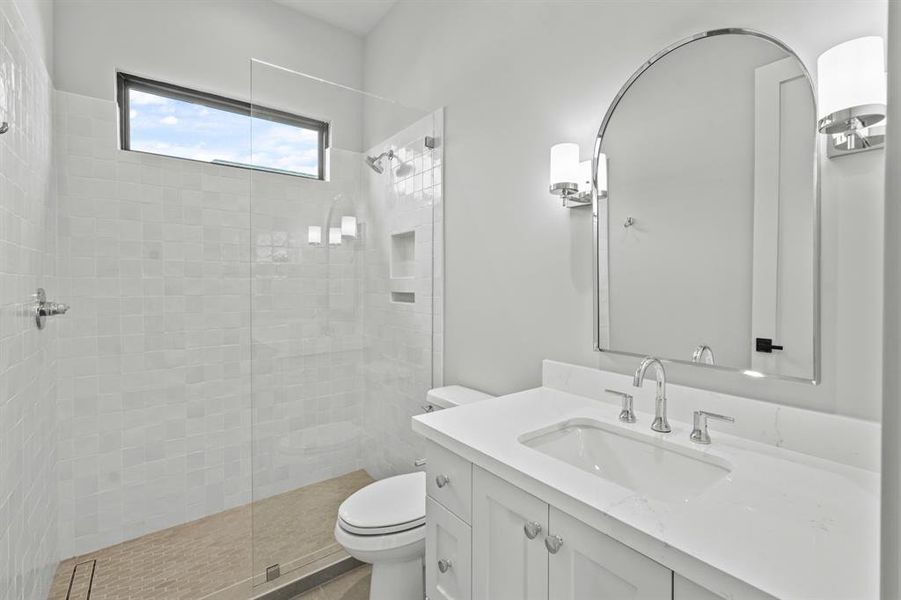 This bright hall bath serves the bedroom and game room!