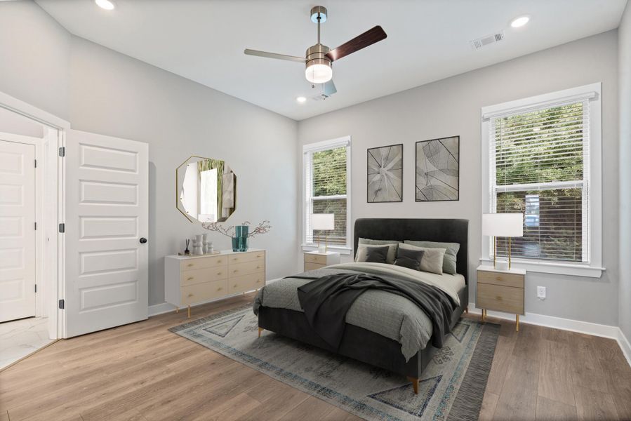 Bedroom featuring wood-finish flooring, recessed lighting, and a ceiling fan Bedroom featuring wood-finish flooring, recessed lighting, and a ceiling fan