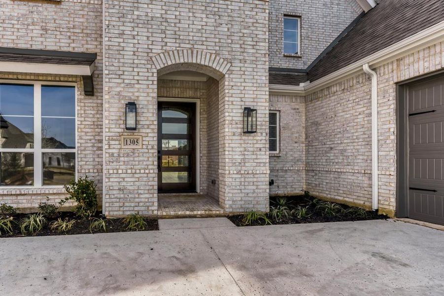 Property entrance with brick siding