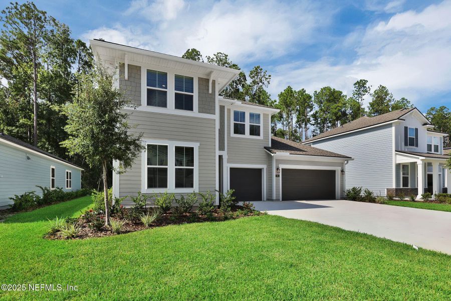 Front exterior of a new home in Trailmark - Phase 10, St. Augustine, FL, highlighting curb appeal (Image 23). Front exterior of a new home in Trailmark - Phase 10, St. Augustine, FL, highlighting curb appeal (Image 23).