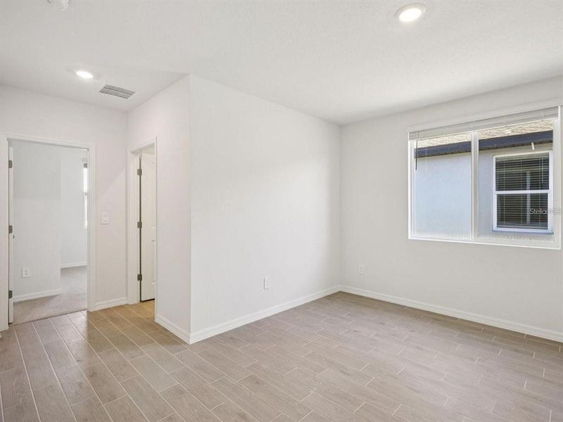Spacious, unfurnished interior of a new home in The Grove at Stuart Crossing - Classic Series, Bartow (Image 10). Spacious, unfurnished interior of a new home in The Grove at Stuart Crossing - Classic Series, Bartow (Image 10).