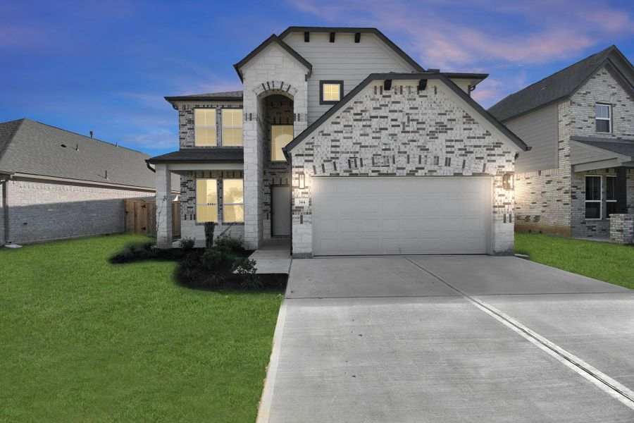 Front exterior of a new home in River Ranch, Dayton, TX, highlighting curb appeal (Image 19). Front exterior of a new home in River Ranch, Dayton, TX, highlighting curb appeal (Image 19).
