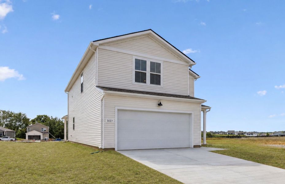 Front exterior of a new home in Highlands of Carter's Station, Columbia, TN, highlighting curb appeal (Image 18).