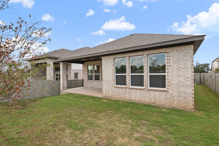 Exterior details and patio area of a home in Arbor Collection At Wolf Ranch, Georgetown (Image 26).
