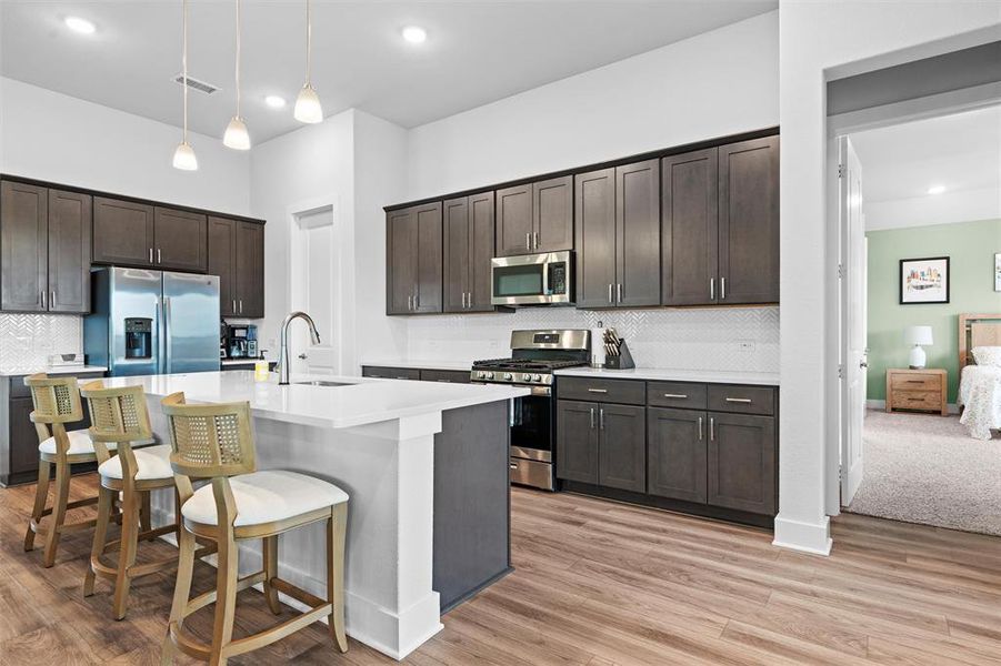 So many cabinets for all of your cooking essentials, and a handy pantry!