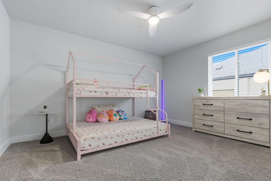 One of two secondary bedrooms upstairs.