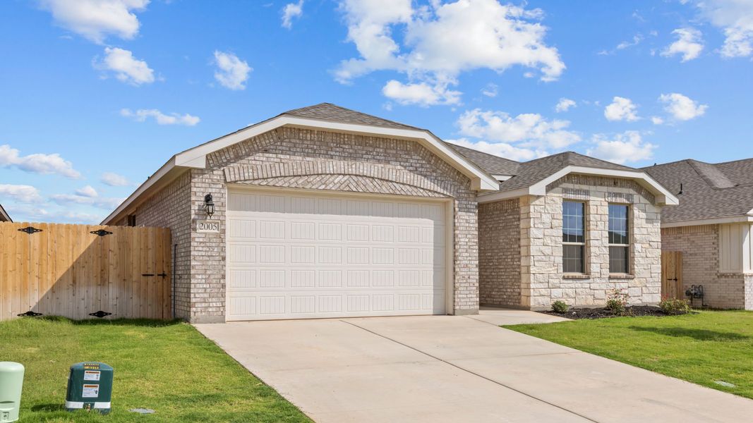 Front exterior of a new home in Northwest Passage, Midland, TX, highlighting curb appeal (Image 14).
