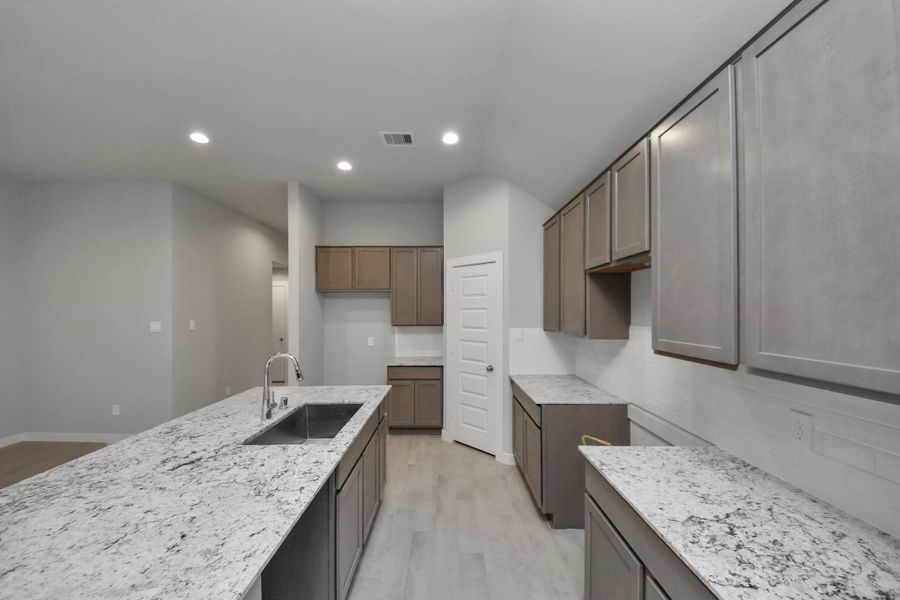 This kitchen is by far any chef’s dream! Sample photo of completed home with similar floor plan. Actual colors and selections may vary.