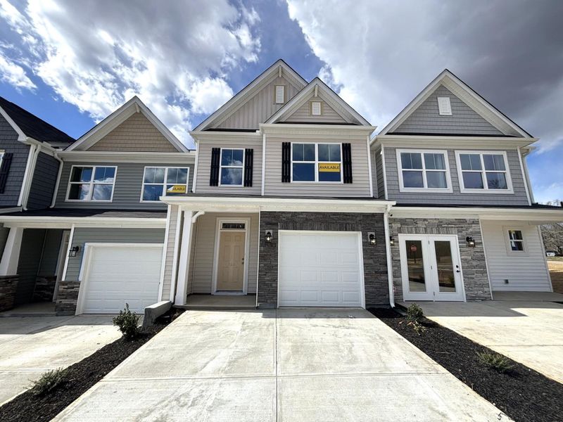 Front exterior of a new home in CraigStone, Woodruff, SC, highlighting curb appeal (Image 1). Front exterior of a new home in CraigStone, Woodruff, SC, highlighting curb appeal (Image 1).