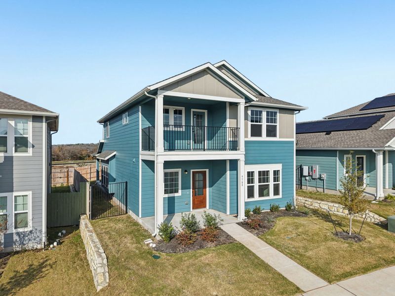 Front exterior of a new home in Whisper Valley, Manor, TX, highlighting curb appeal (Image 2). Front exterior of a new home in Whisper Valley, Manor, TX, highlighting curb appeal (Image 2).