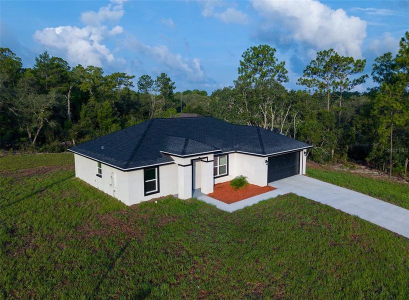 Front exterior of a new home in , Dunnellon, FL, highlighting curb appeal (Image 25).