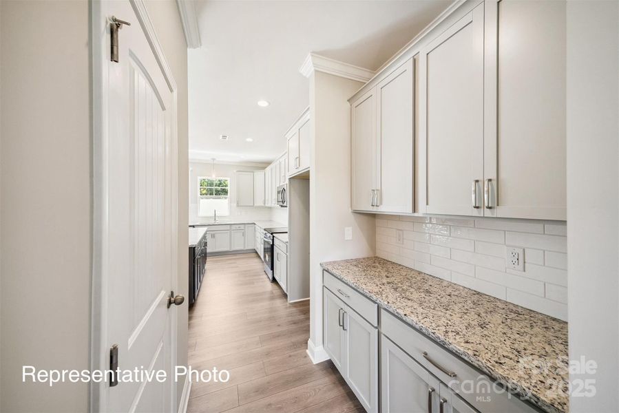Furnished interior view inside a new home in , Wingate (Image 9).