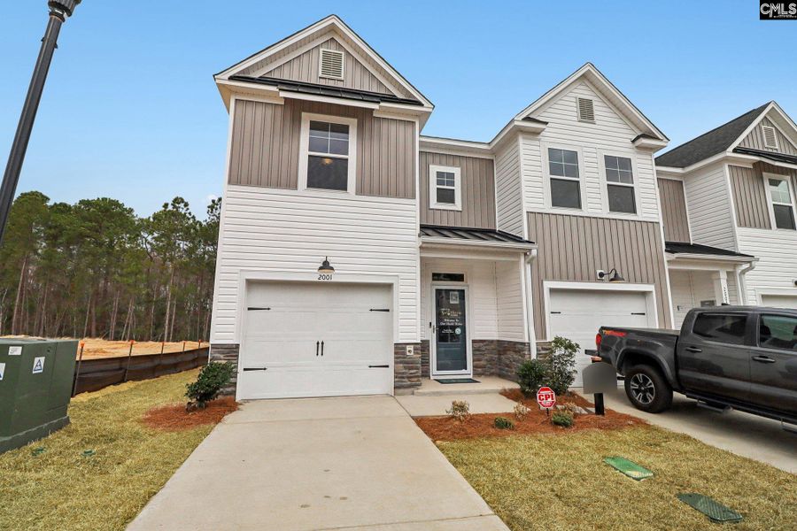 Front exterior of a new home in Victory Woods, Columbia, SC, highlighting curb appeal (Image 25). Front exterior of a new home in Victory Woods, Columbia, SC, highlighting curb appeal (Image 25).