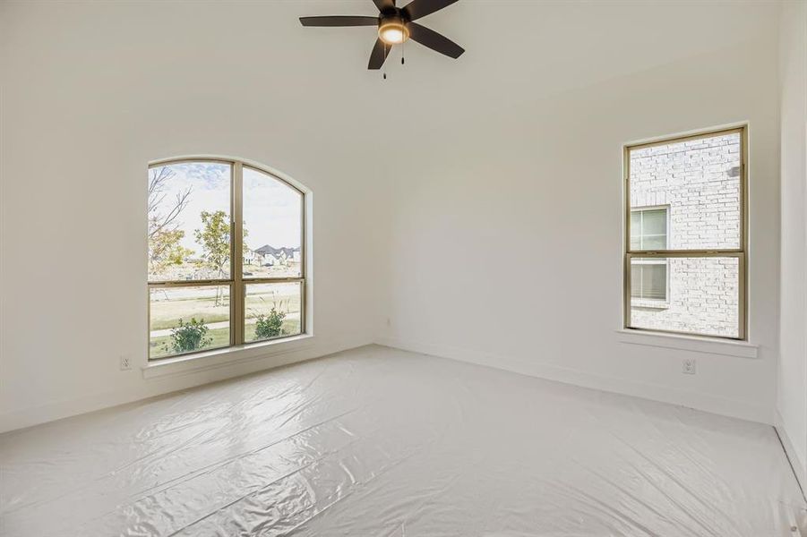 Spare room with baseboards and ceiling fan Spare room with baseboards and ceiling fan