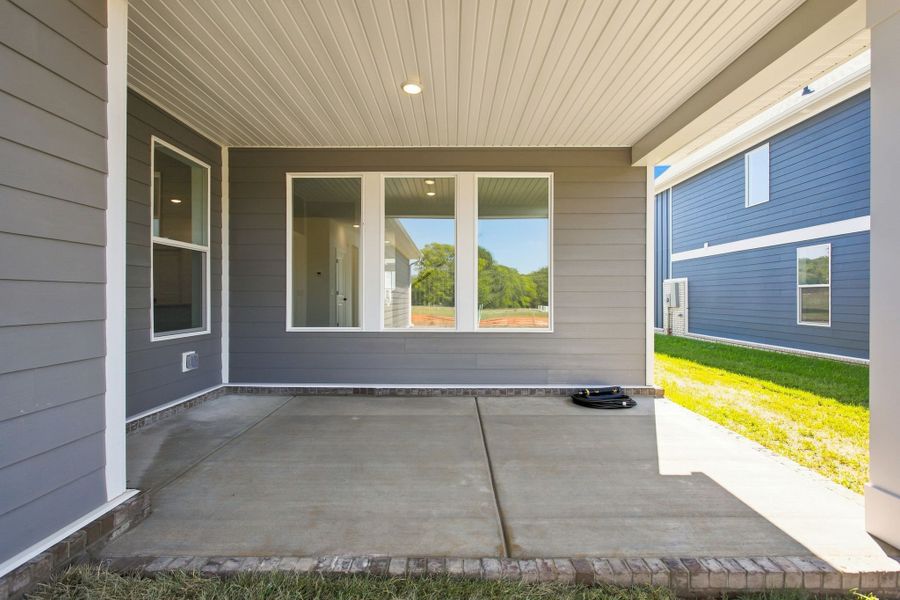 Exterior details and patio area of a home in Heritage Green – The Porch Collection, Columbia (Image 4).