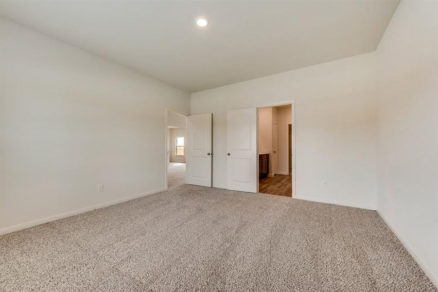 Unfurnished bedroom with carpet floors