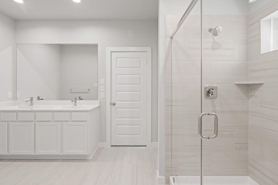 Furnished interior view inside a new home in Sunterra North, Katy (Image 9).