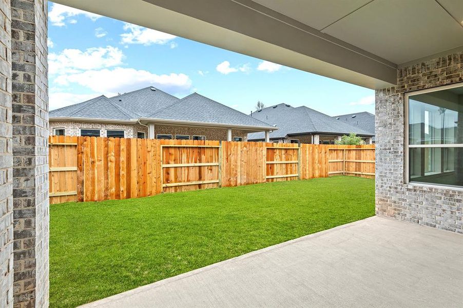 View of rear yard from patio