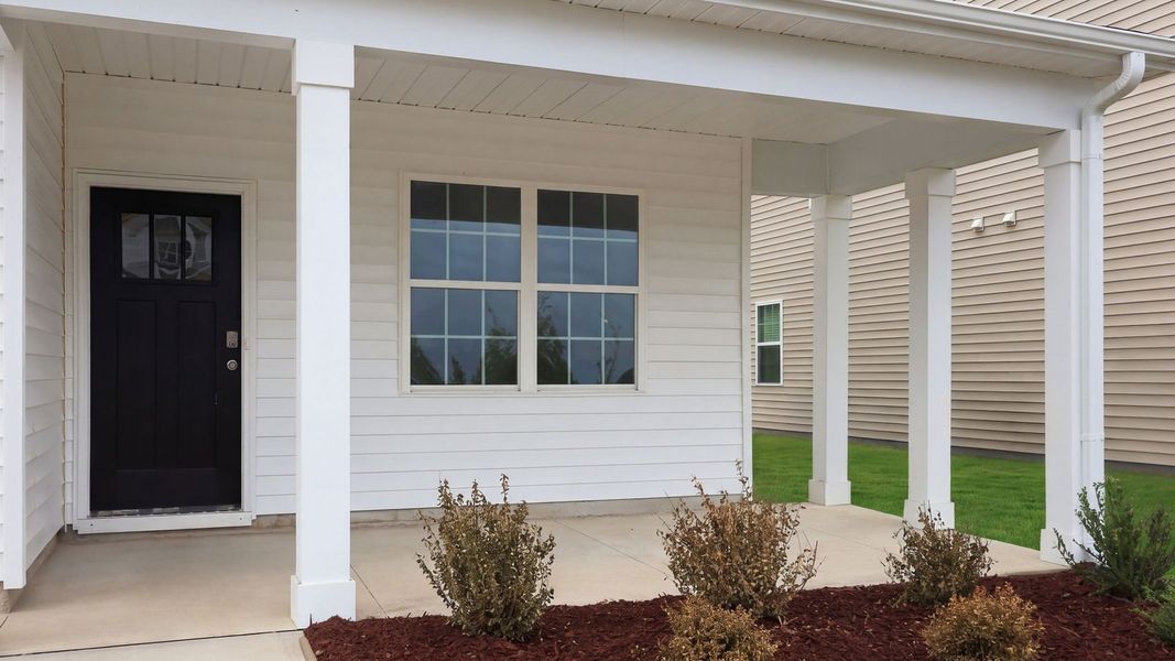 Exterior details and patio area of a home in Ridgewood Farms, Winterville (Image 3).