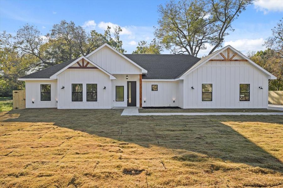 View of front of property with a front lawn