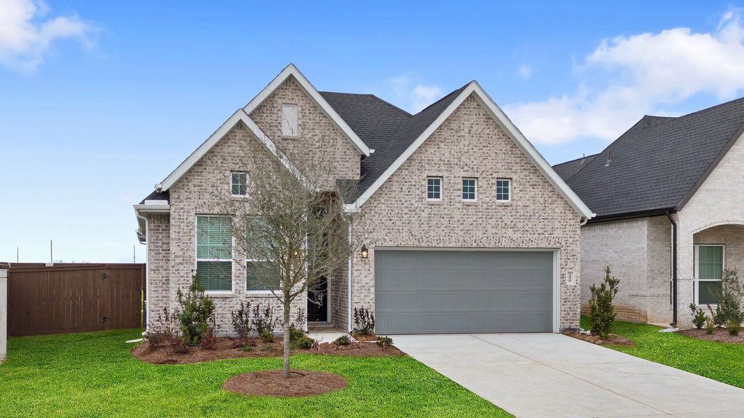 Front exterior of a new home in Brookewater, Rosenberg, TX, highlighting curb appeal (Image 15). Front exterior of a new home in Brookewater, Rosenberg, TX, highlighting curb appeal (Image 15).