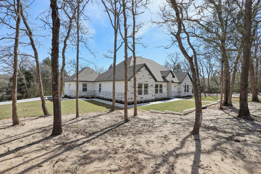 Front exterior of a new home in , Elgin, TX, highlighting curb appeal (Image 22).