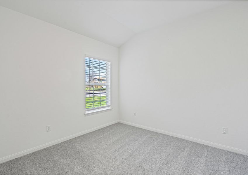 Secondary bedroom with lush carpet