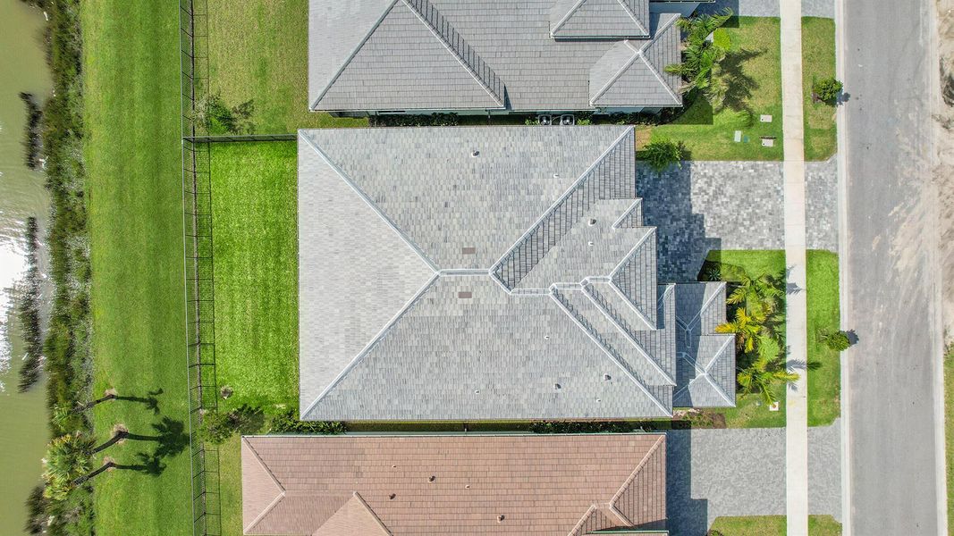 Front exterior of a new home in Apex at Avenir, Palm Beach Gardens, FL, highlighting curb appeal (Image 30).