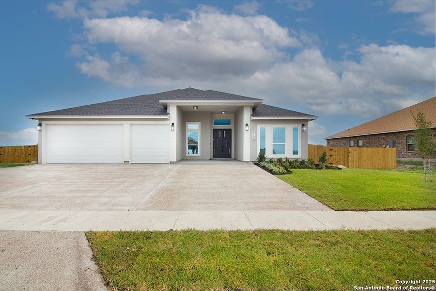 Front exterior of a new home in , Corpus Christi, TX, highlighting curb appeal (Image 1).