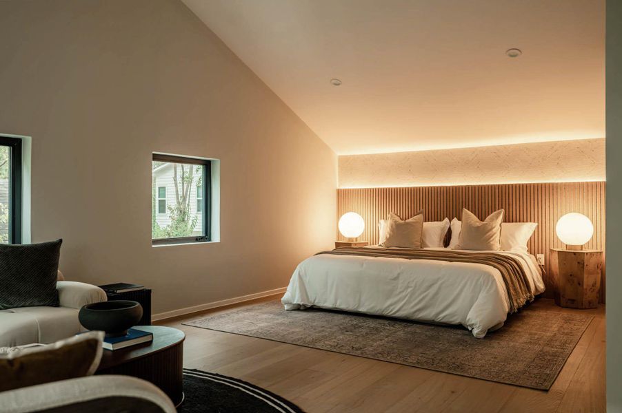 Secondary primary suite with sitting area and multiple windows upstairs