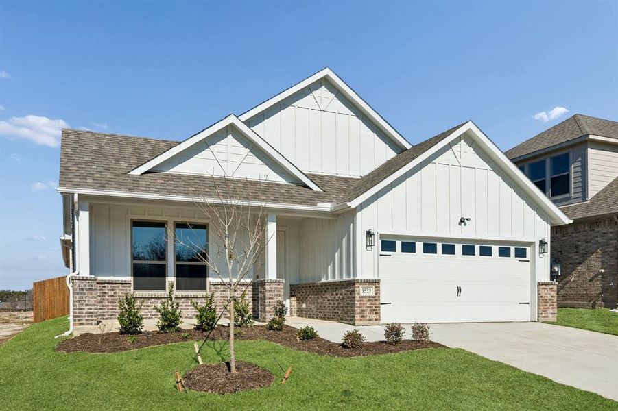Front exterior of a new home in Freeman Farms, Kaufman, TX, highlighting curb appeal (Image 2). Front exterior of a new home in Freeman Farms, Kaufman, TX, highlighting curb appeal (Image 2).