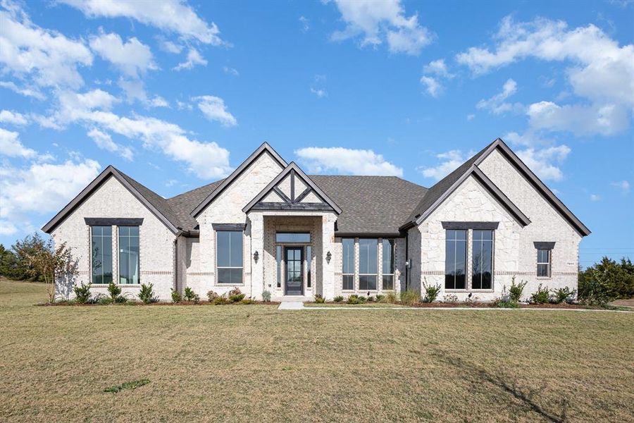 Front exterior of a new home in Sagebrush Addition, Midlothian, TX, highlighting curb appeal (Image 2).
